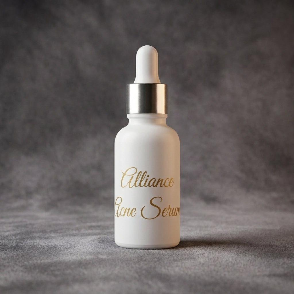 A white skincare dropper bottle with gold foil lettering that reads 'Alliance acne Serum' on a textured gray background.