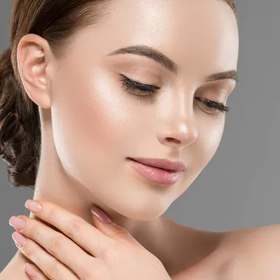 Smiling female model with clear, radiant skin showcasing the effects of StayOn Fairness Cream, representing healthy, glowing, and even-toned complexion